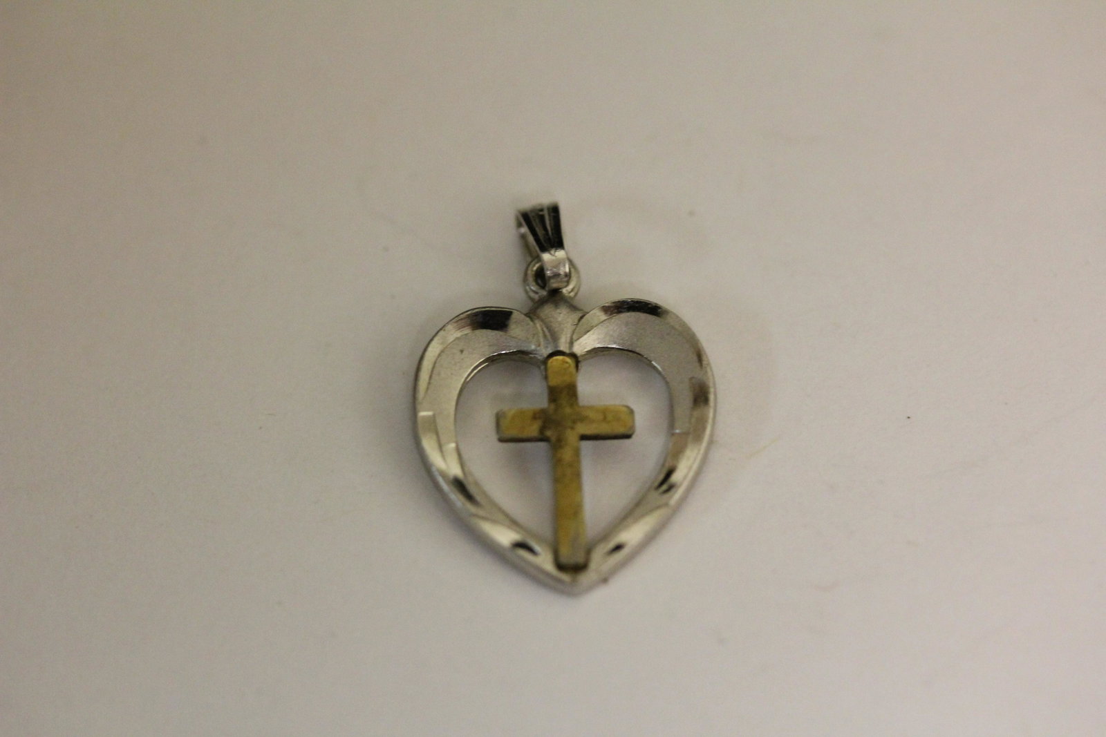 A Sterling Charm - Heart with a Cross: marked as shown