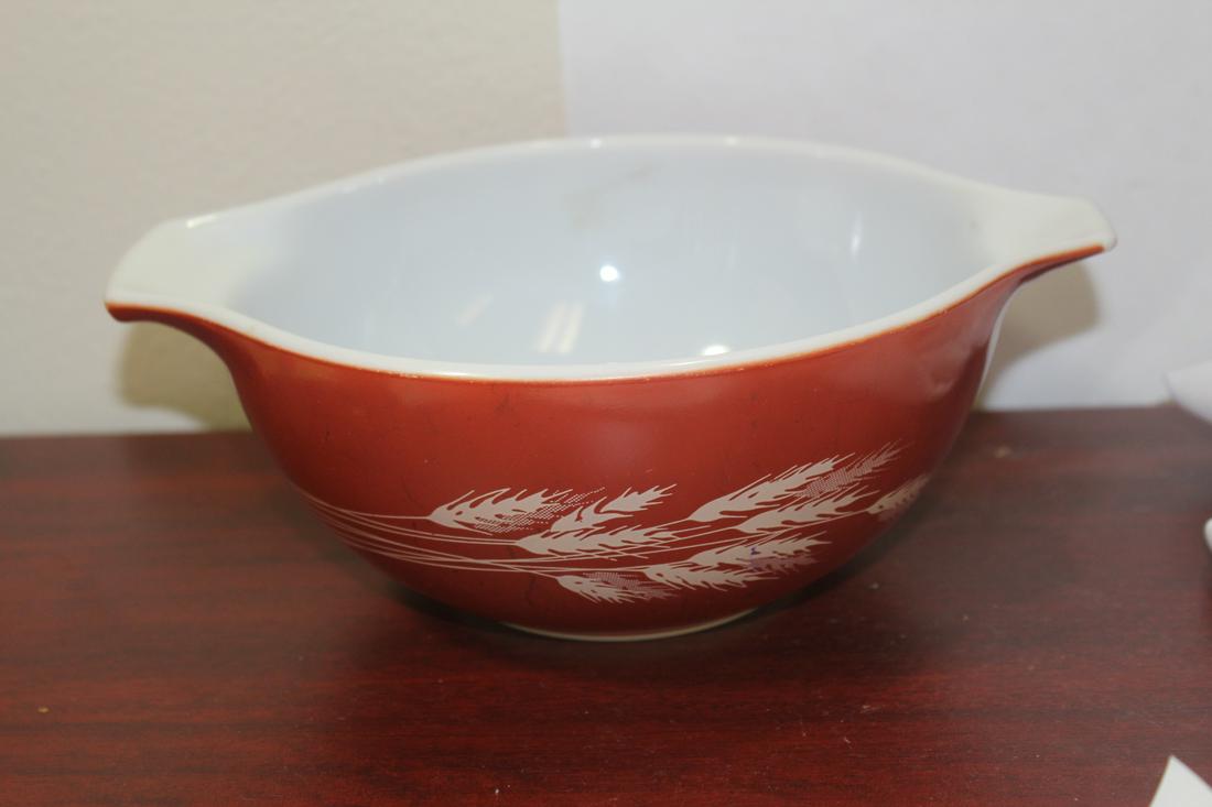 A Pyrex Bowl: 9 1/4" in diameter from handle to handle