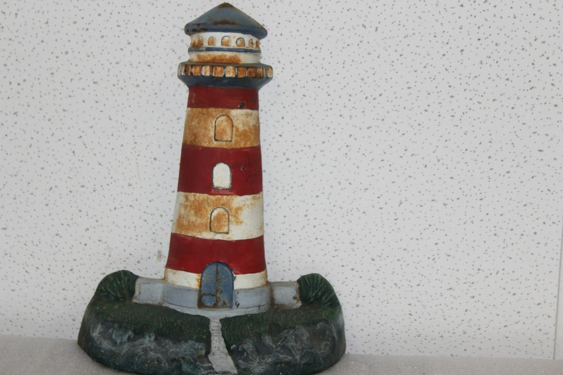 A Vintage Lighthouse Cast Iron Door Stopper: 12 1/4" tall