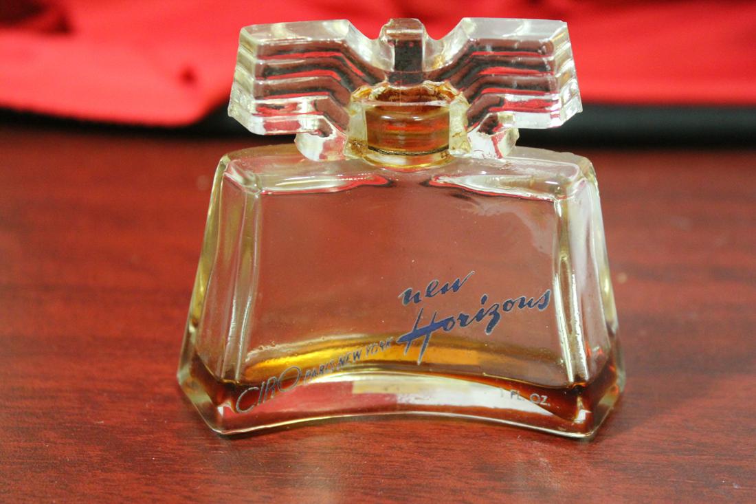 An Art Deco Parfume Bottle: "New Horizon Thunderbird" - very little parfume left - 2 7/8" tall
