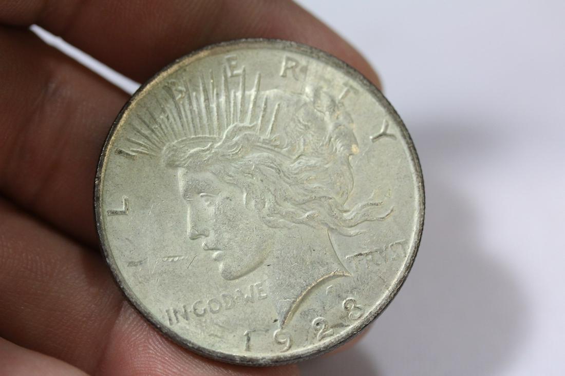 A 1923 Peace Silver Dollar: as shown