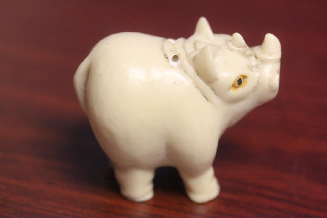 A Resin Rhino Figurine - Netsuke: 2 inches across