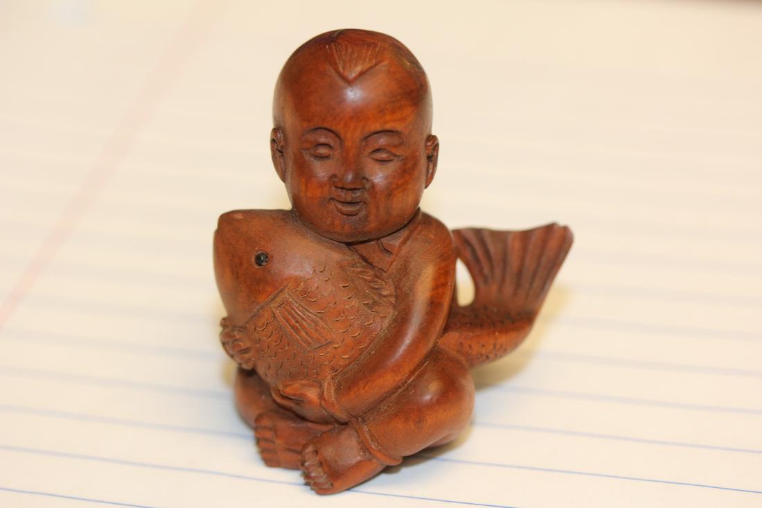 A Signed Japanese Wooden Netsuke: 2" tall
