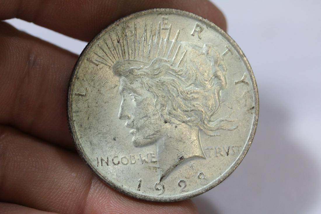 A 1923 Peace Silver Dollar: as shown