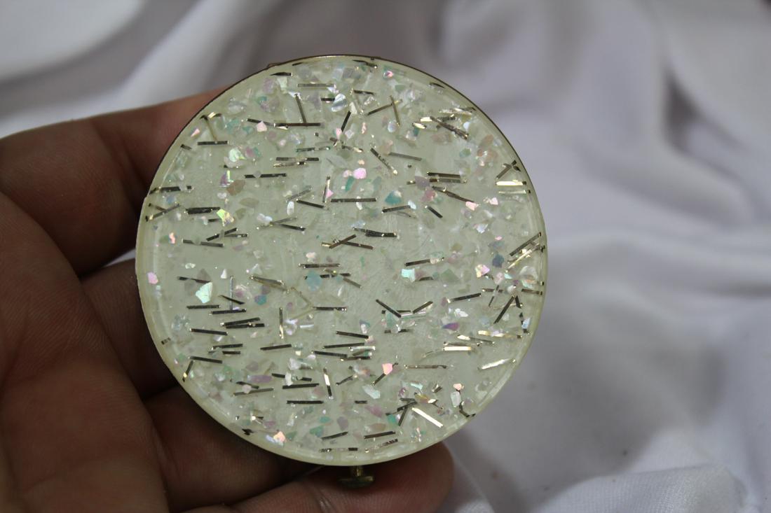 A Compact: 2 3/8" in diameter