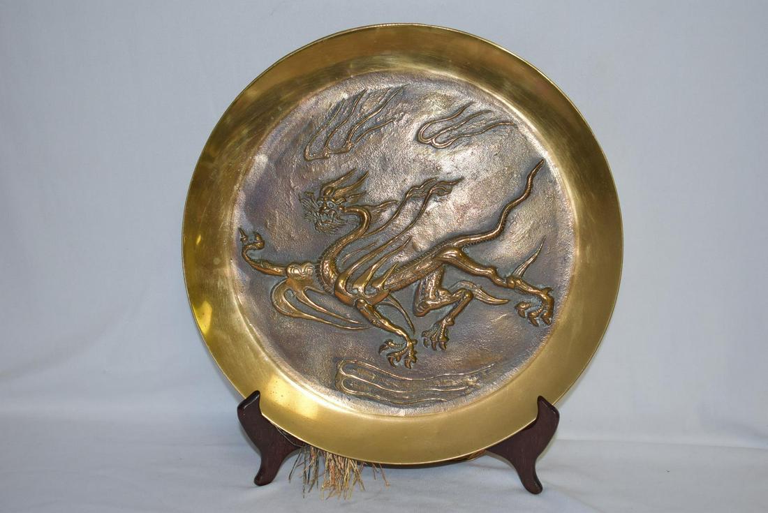 A Brass Dragon Plate: with tessels - appears to be old - possibly bronze - either Chinese, Japanese or Korean - 11 3/8" in diameter
