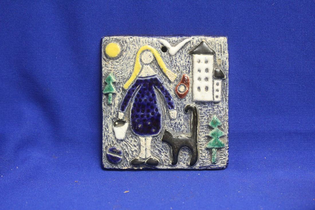 A Ceramic Tile: 4" x 4 1/8"