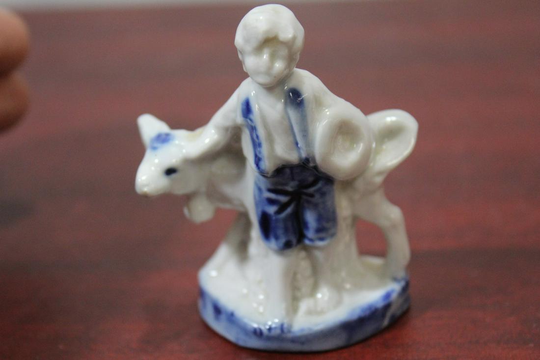 A Small Flow Blue and White German Figurine: 2 3/4" tall