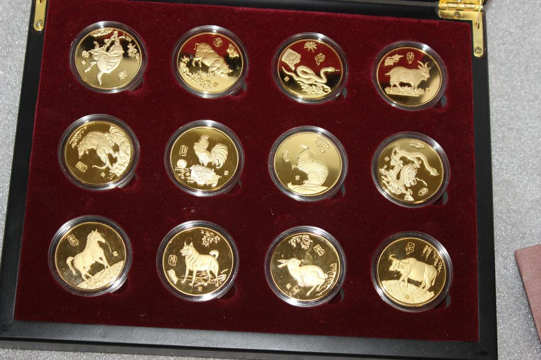 A Set of Chinese Zodiac Gold Plated Coins: with paperwork - in box