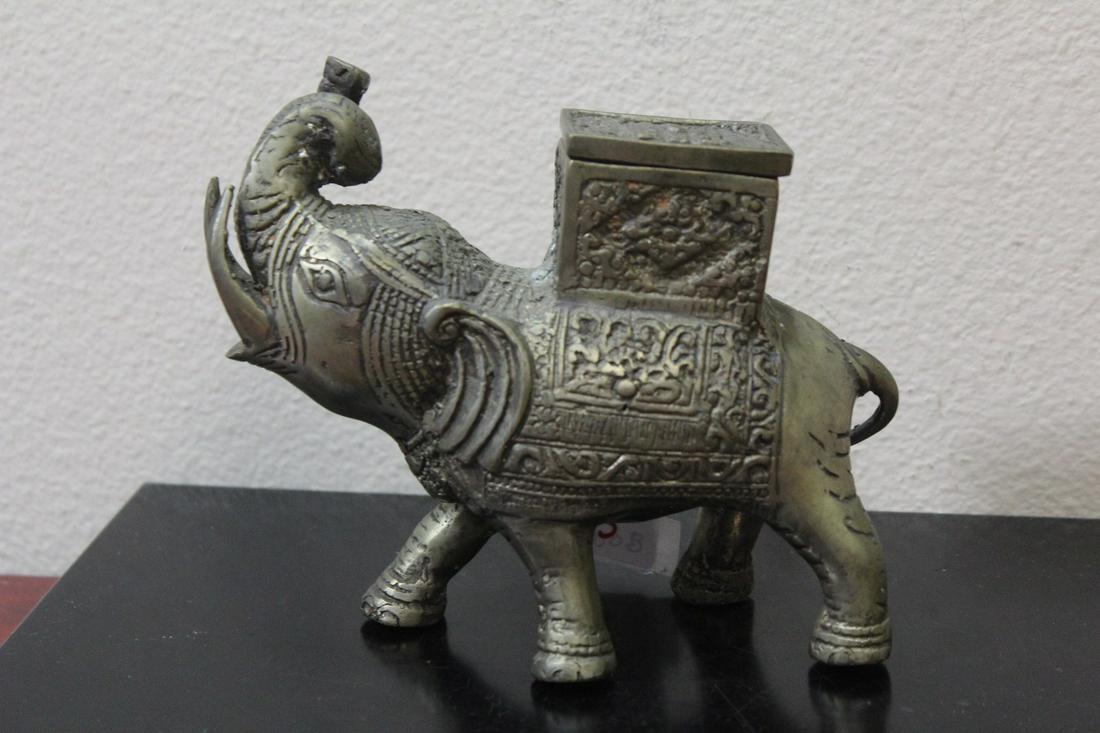 A Metal Elephant: 6 1/4" long - either brass, bronze or other metal - possibly old - the whole thing is a box
