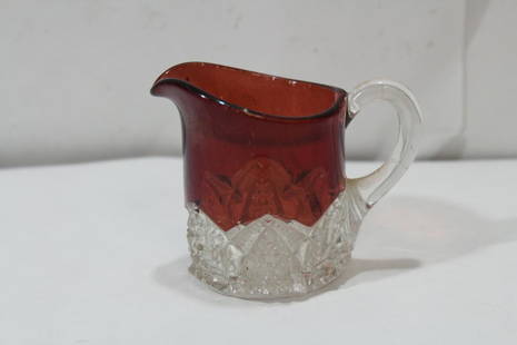 A Small Glass Pitcher: cranberry or amber color - 2 3/4" tall