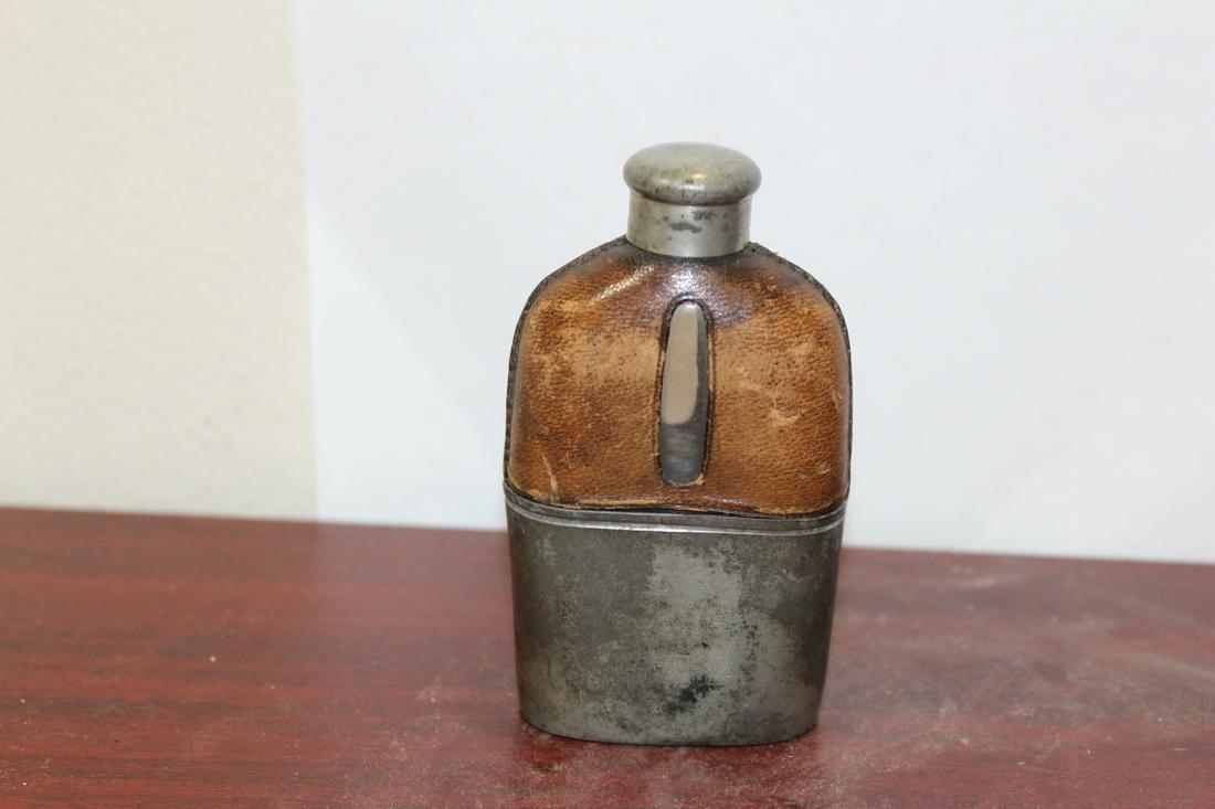 A Leather over Glass Liquor Flask: probably early 1900's - 4 1/4 inches tall
