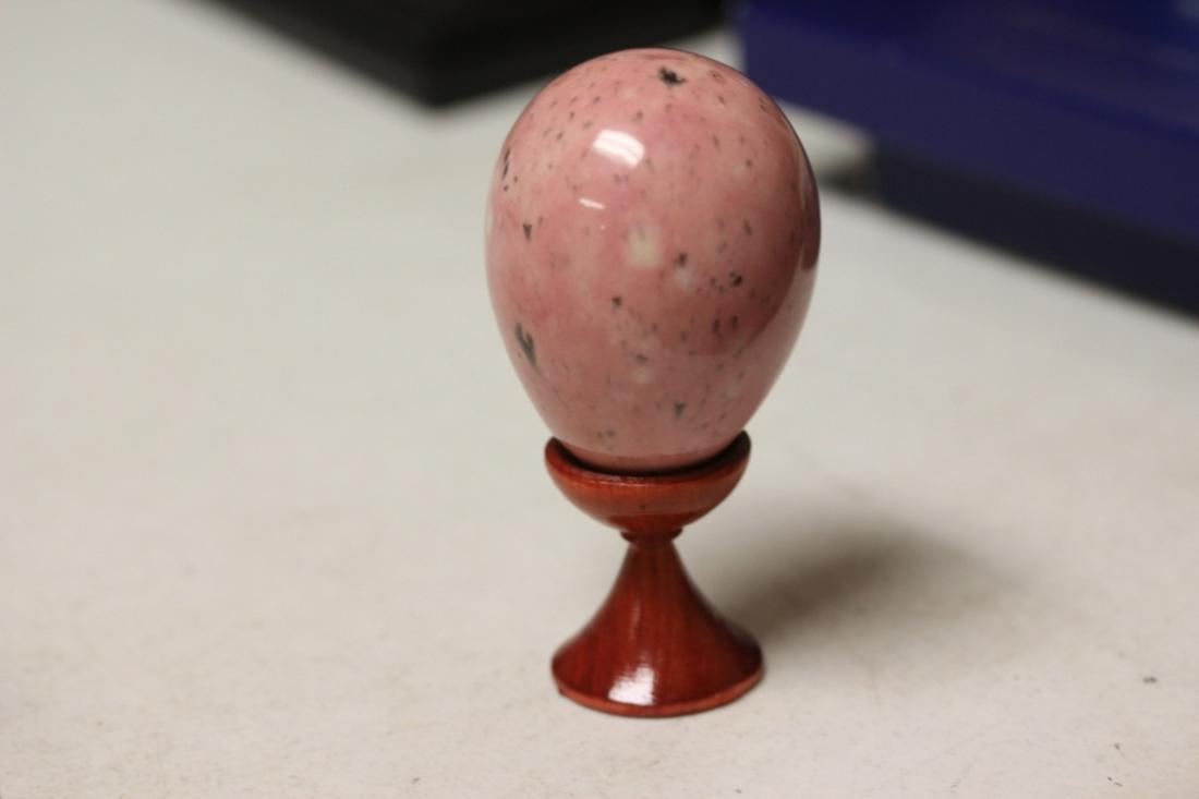 A Decorative Enamel Egg: believed to be a real egg - on stand - Overall= 4"tall