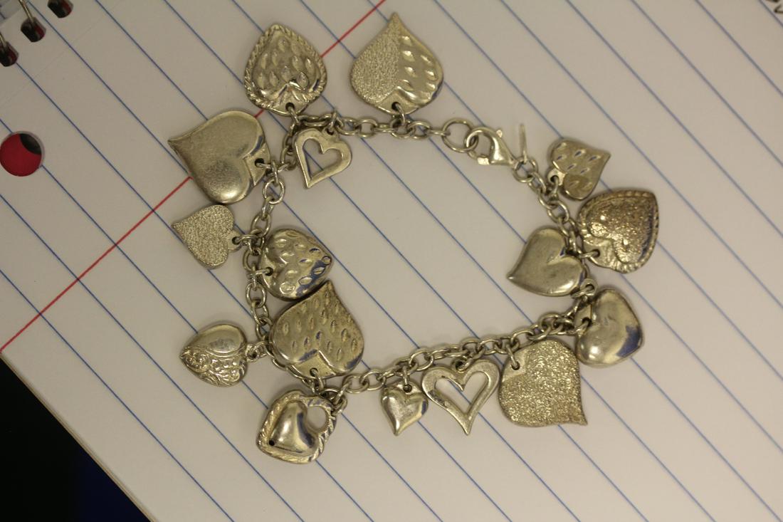 A Sterling Heart Charm Bracelet: approximately 3 3/8" when clapsed