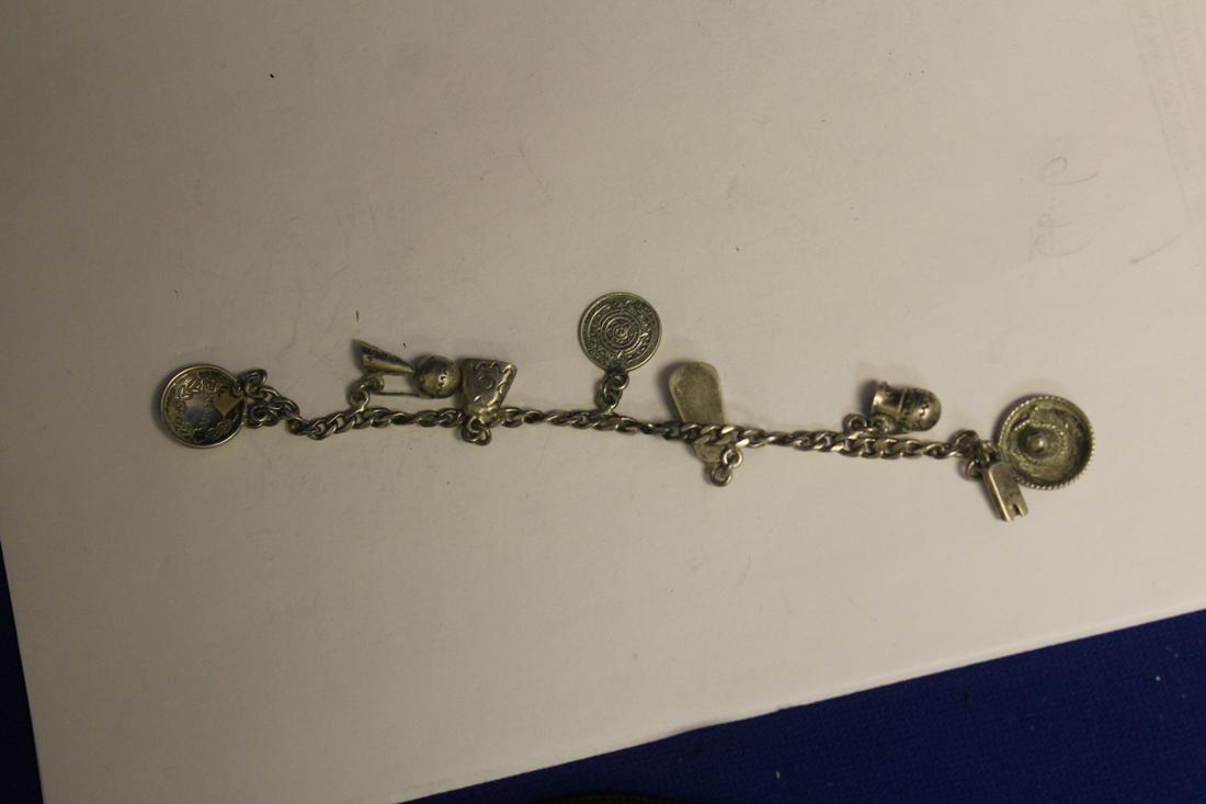 A Sterling Charm Bracelet: for a small wrist