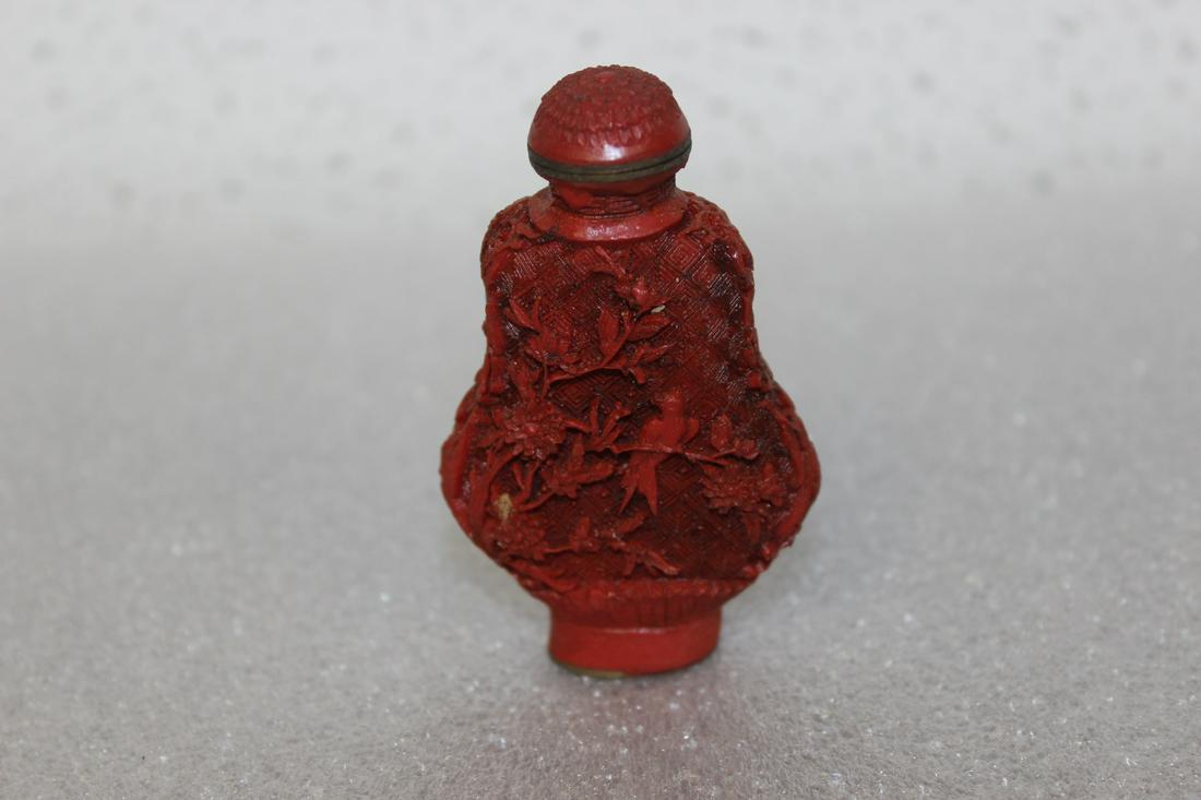 A Vintage Chinese Cinnabar Style Snuff Bottle: Resin construction - signed - 3" tall