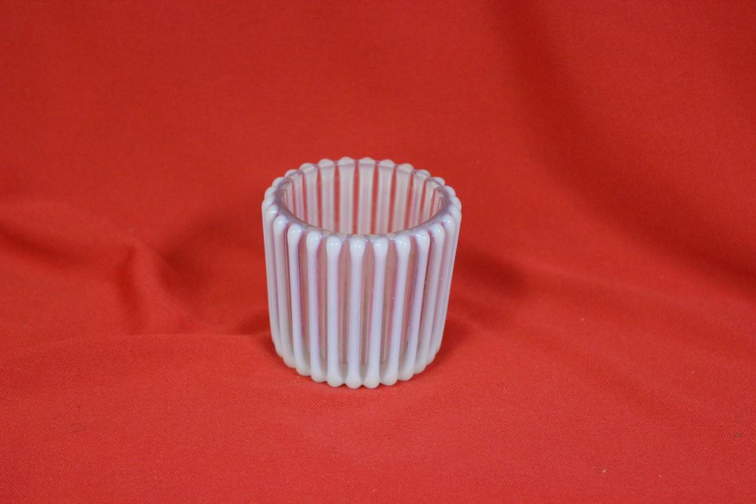 An Iridesent? Glass Toothpick Holder: 2" tall - please note: inside chip between coloumns