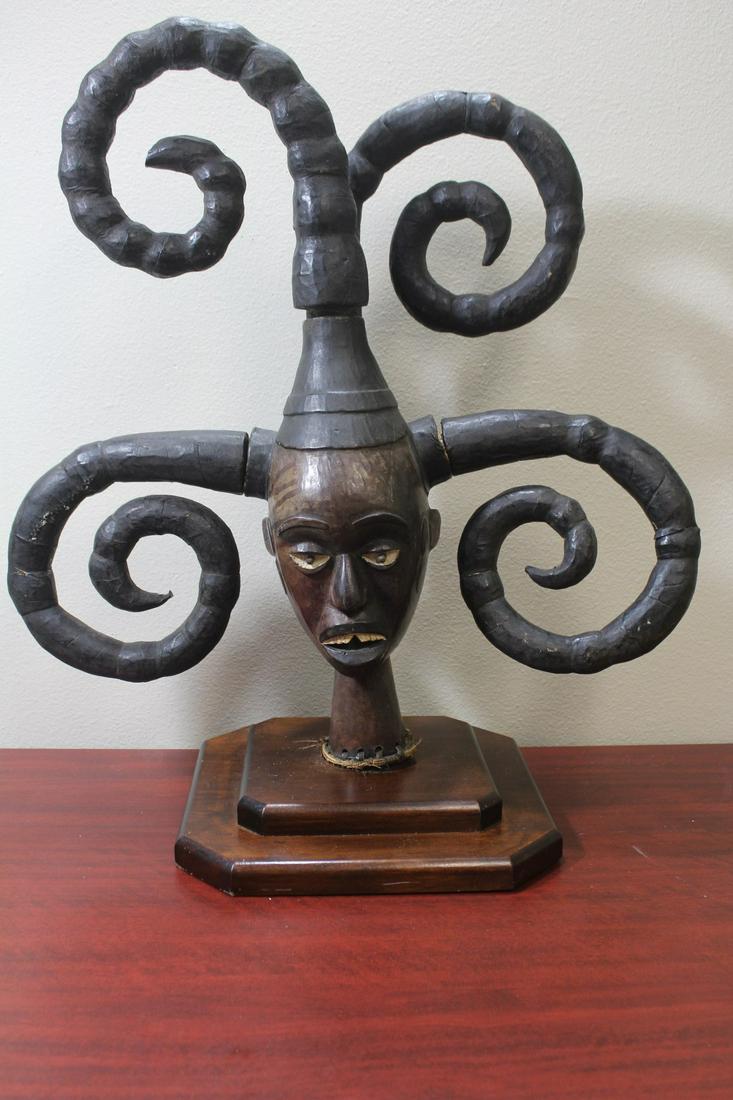 An African Wooden Statue: with 4 horns or hairs - possibly Nigerian - 17 1/4" tall without the head pieces - most likely an older piece