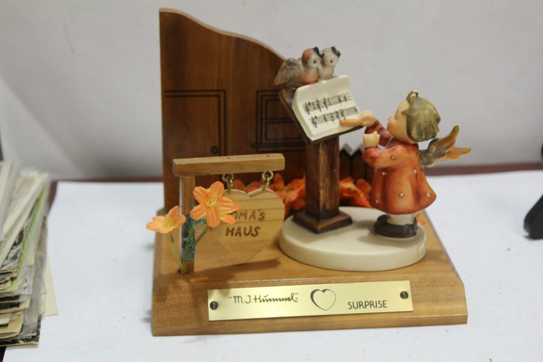 A Hummel Figurine: with wooden housing - 4 1/8" tall (figure only)