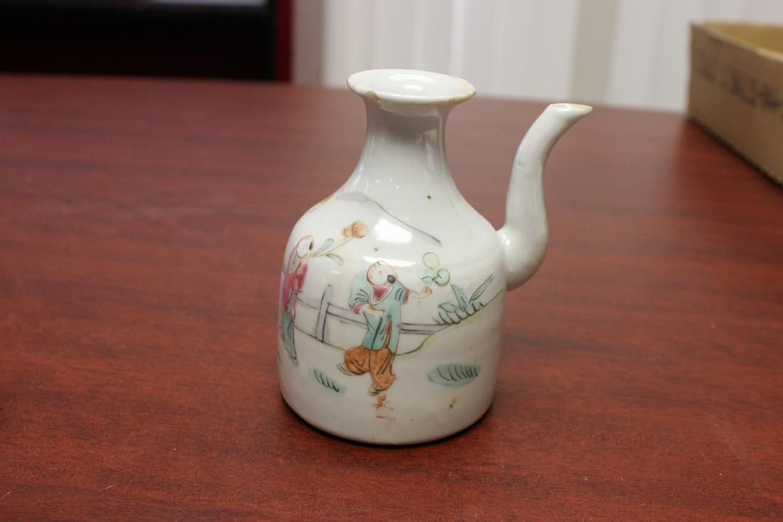 A Chinese Wine Bottle: please note: underchip - 4 3/8" tall