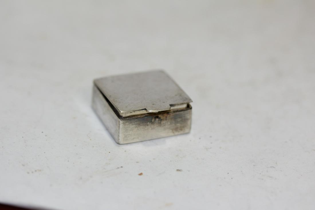 A Sterling Pill Box: one inches square