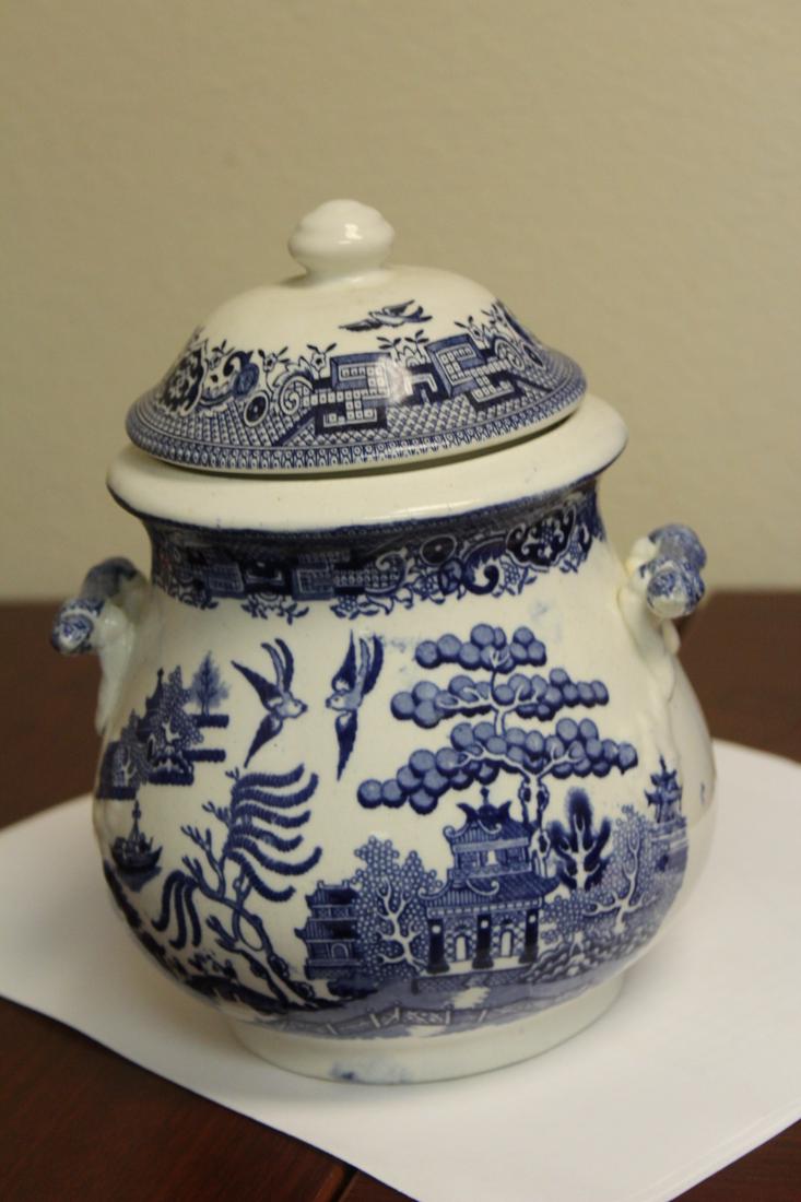 A Staffordshire Blue Willow Jar: with lid and two handles - 7 1/2" tall