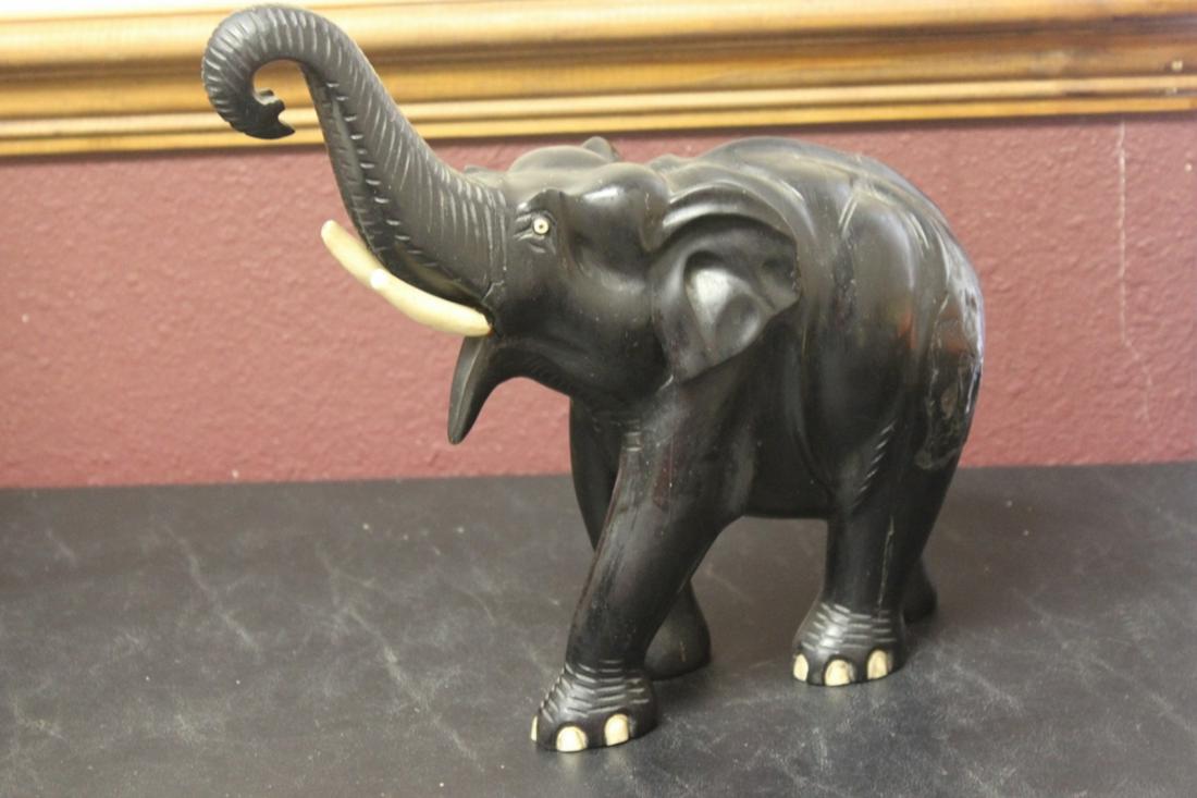 A Heavy Ebony Wood Elephant: please note: losses and cracks - 11" long