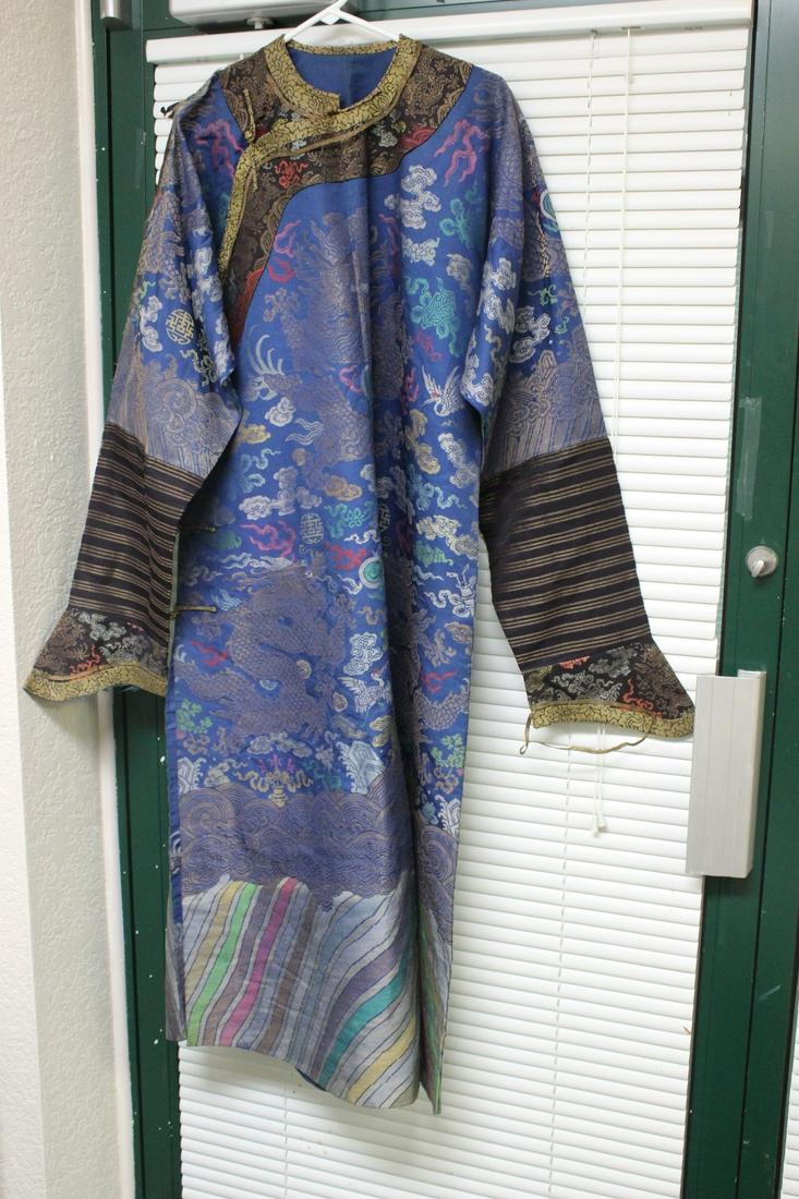 An Antique Chinese Dragon Robe: 53" long x 24" underarm measurement - early 20th century - please note: burnt on the shoulder, needs repair