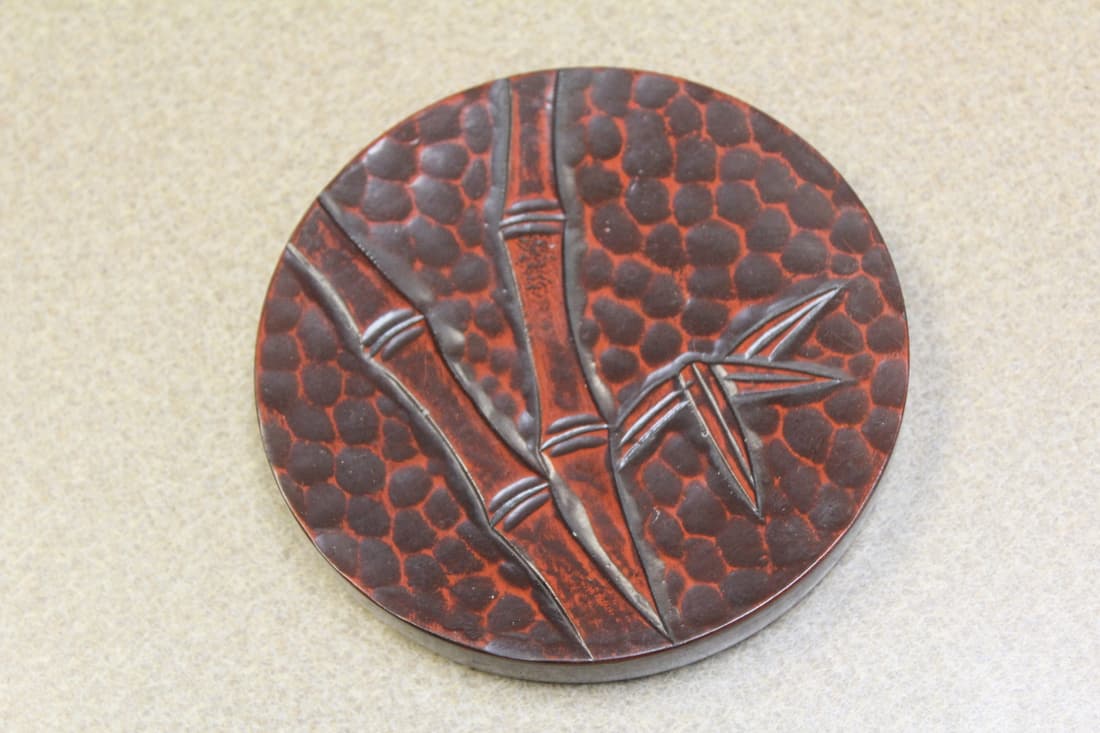 Japanese Cinnabar Style Round Trivet: 5 1/4" in diameter - vintage