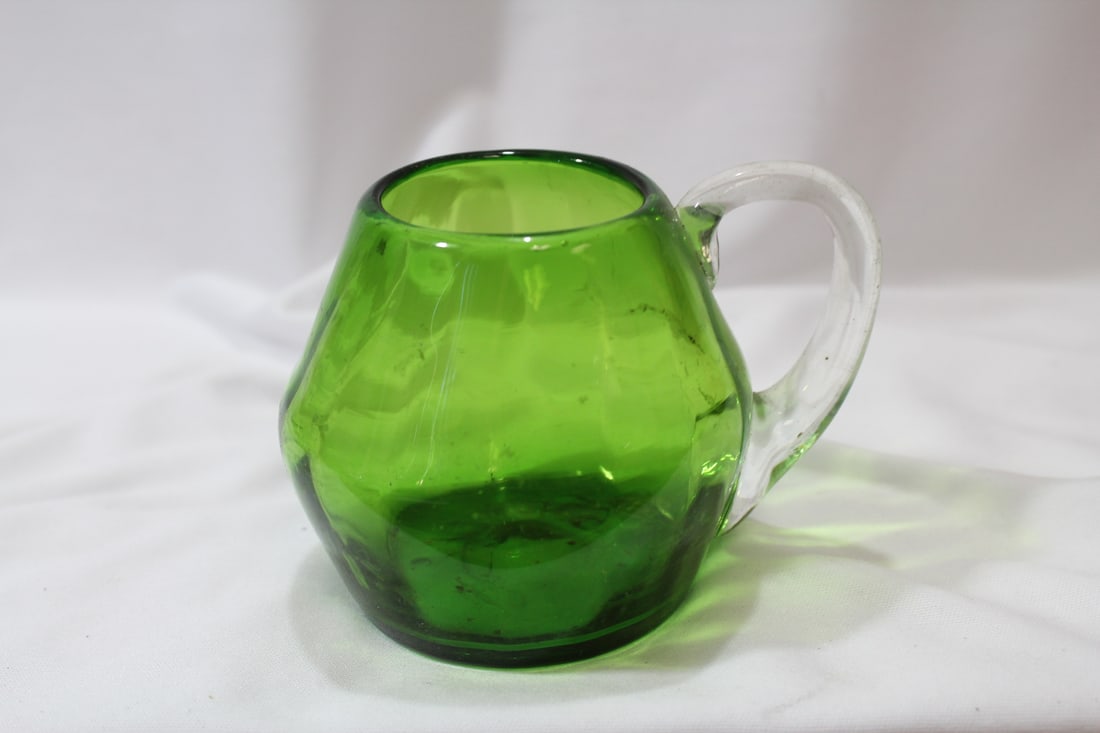 A Green Glass Cup: 3 1/2" tall