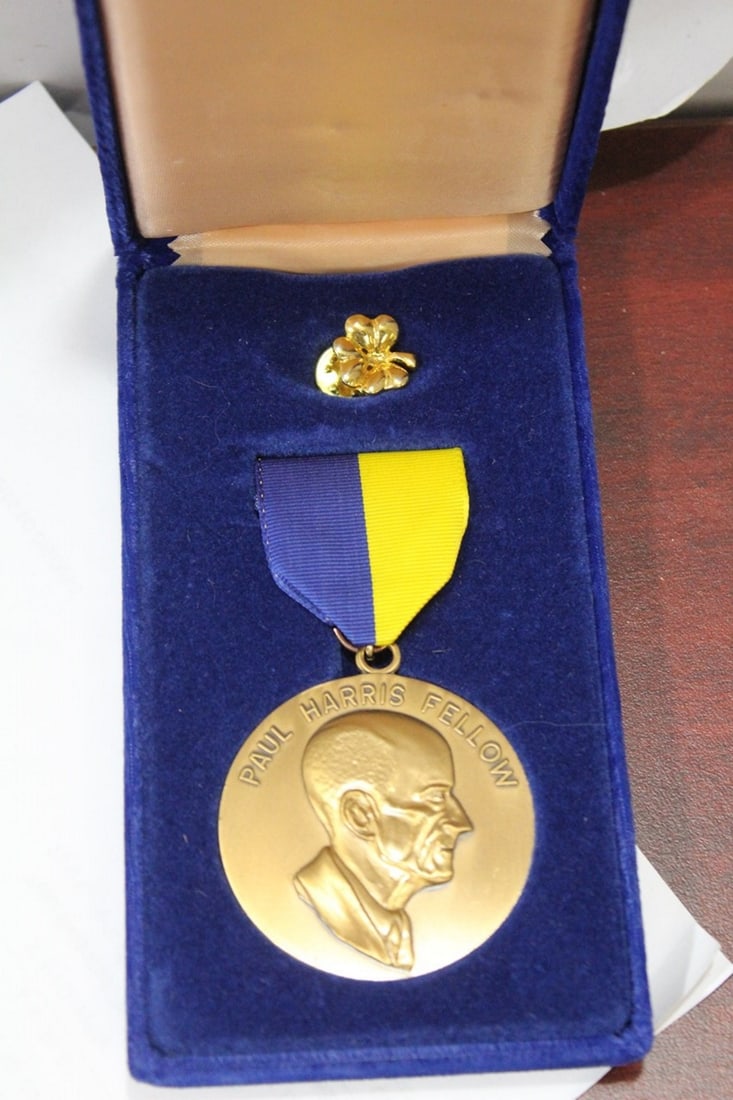 A Paul Harris Fellow Award: rotary international service - cased with tie tag - bronze