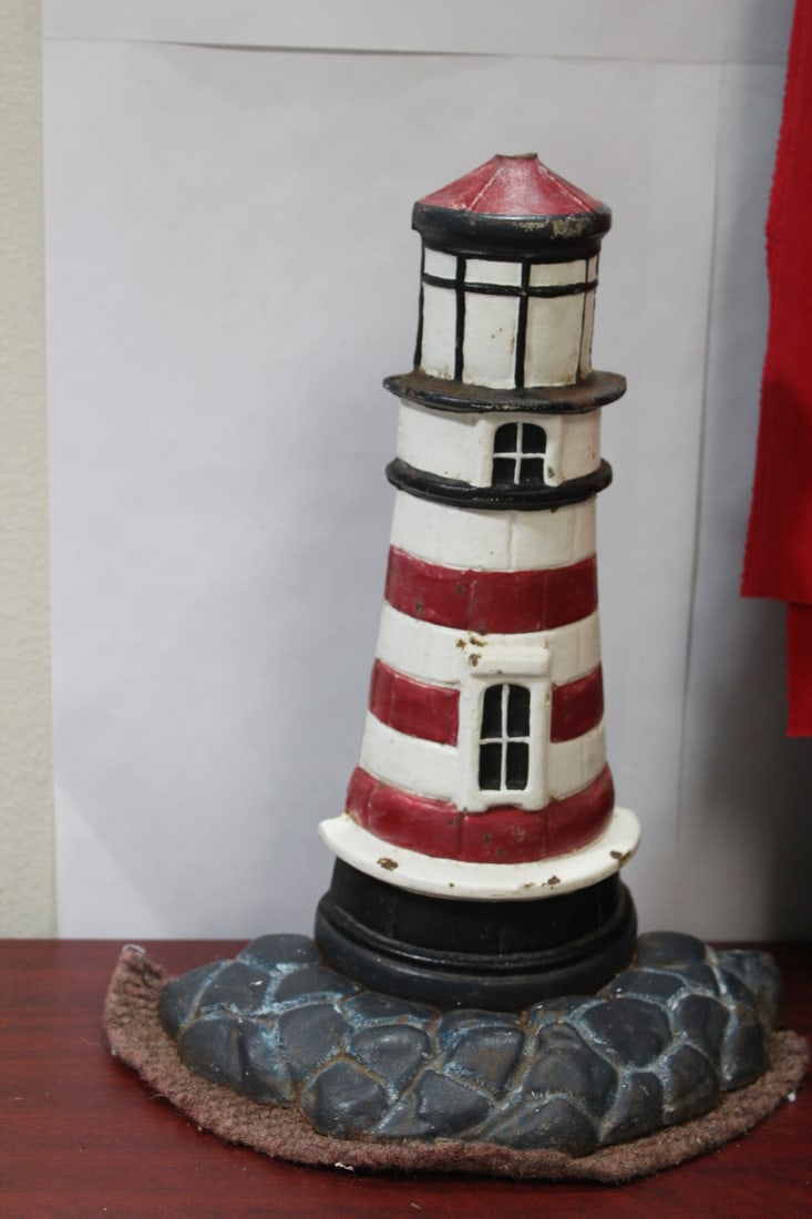 A Vintage Cast Iron Lighthouse Door Stopper: 14" tall
