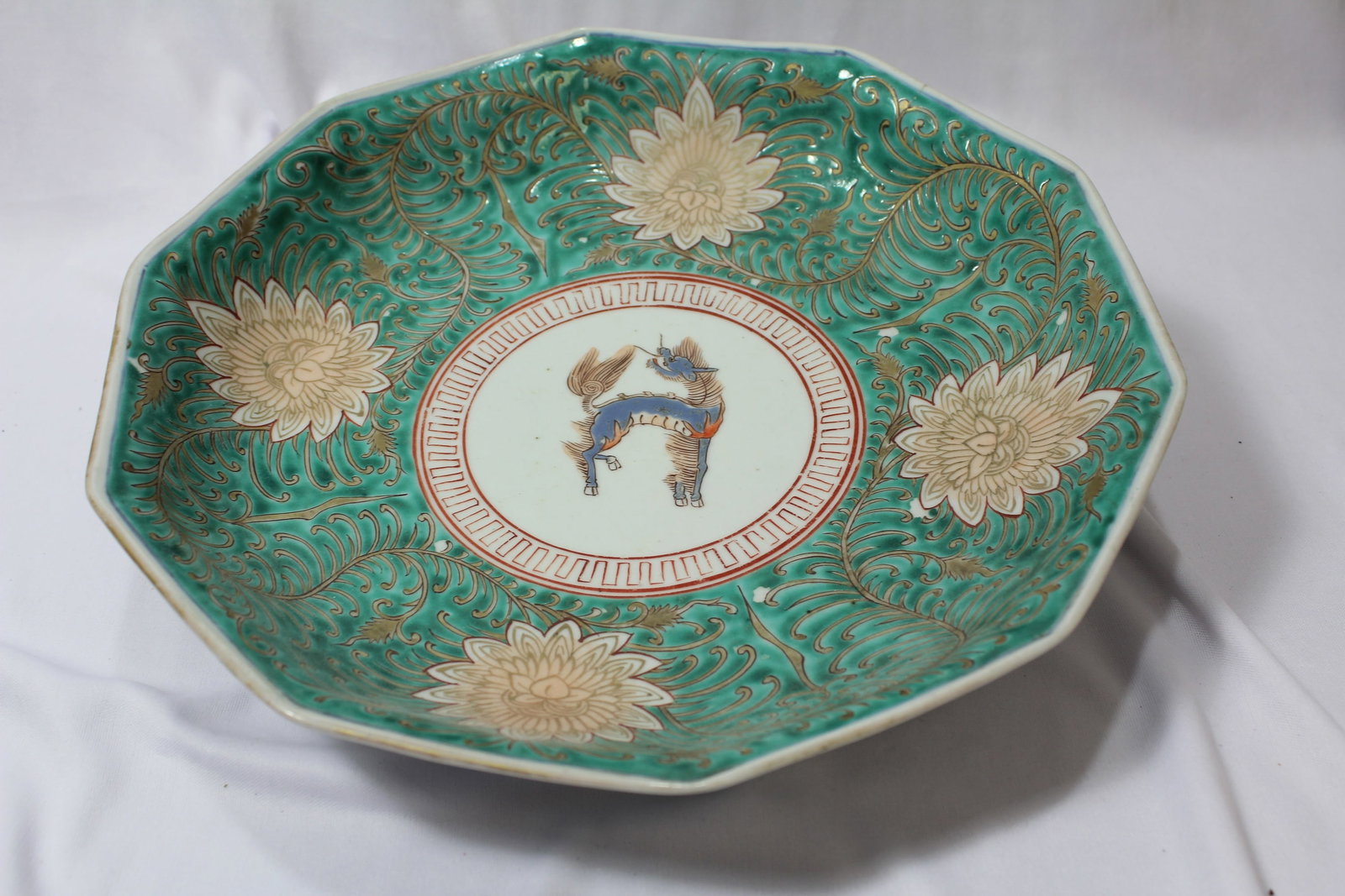 Antique Japanese Imari Bowl: 12" in diameter. Circa 19th century. Very well designed, with a very unusual design. Signed - please note: hairline as shown