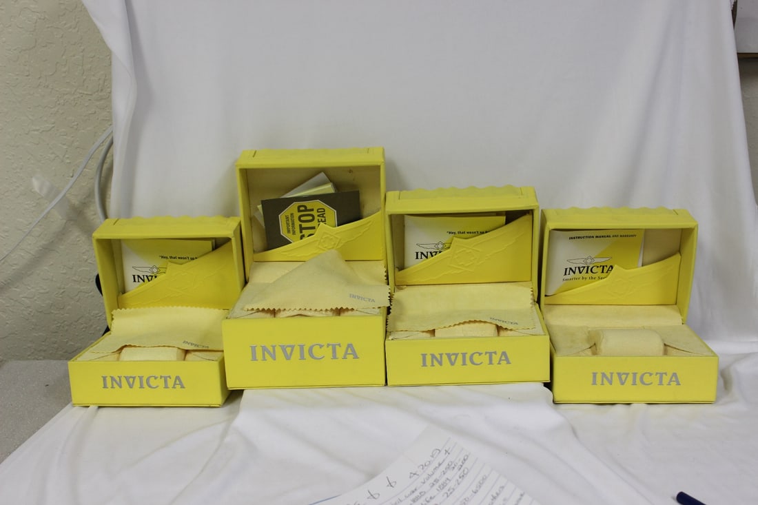 Empty Invicta Boxes: lot of 4 - all the same sizes - measures: 5 3/4" x 4 1/2" x 3 3/4" - all have some sort of paperwork inside - please note: no watches inside!