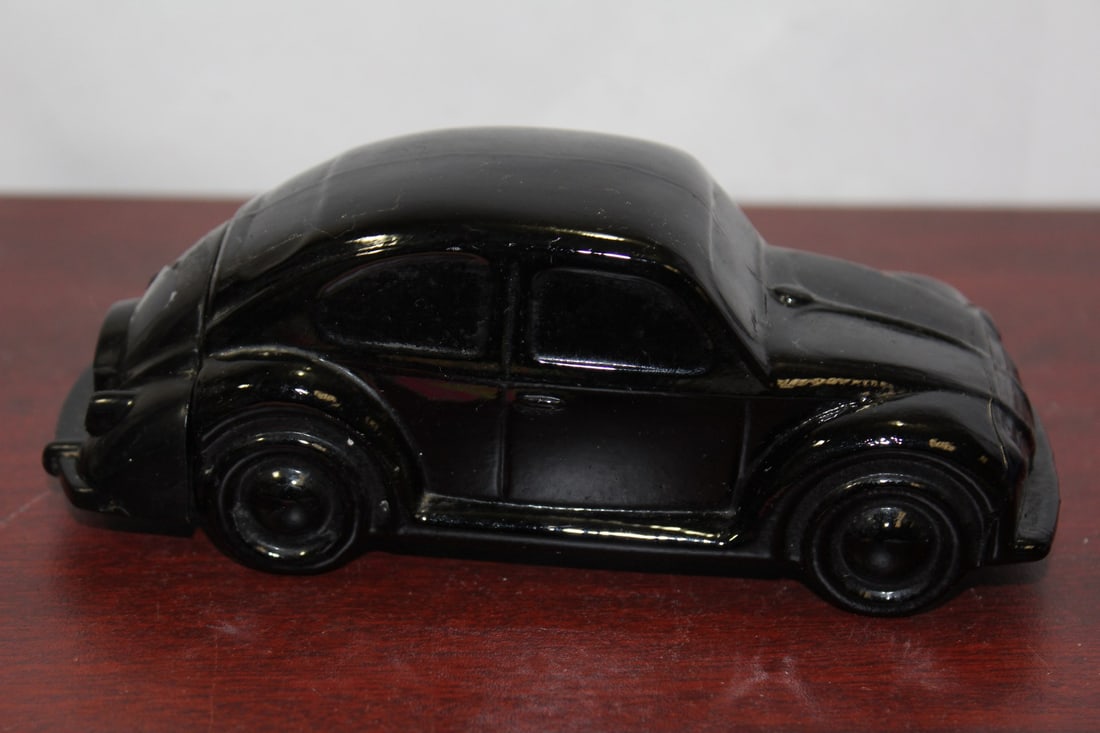 An Avon Glass Volkswagen Beetle After Shave Bottle: 5 3/4" long