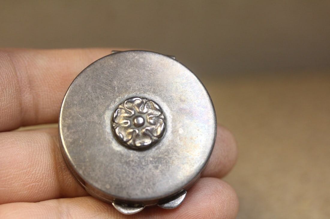 sterling pill box: 1 1/2" in diameter, about 100 year old