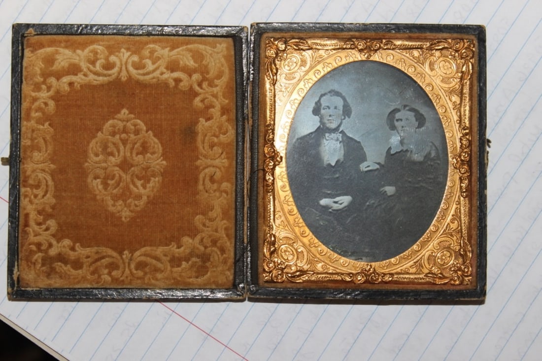 A Glass Tin Type Photograph: Inside a gold gilted frame - frame needs to be rehinged overall - 3 5/8" x 3 3/4" - 19th century