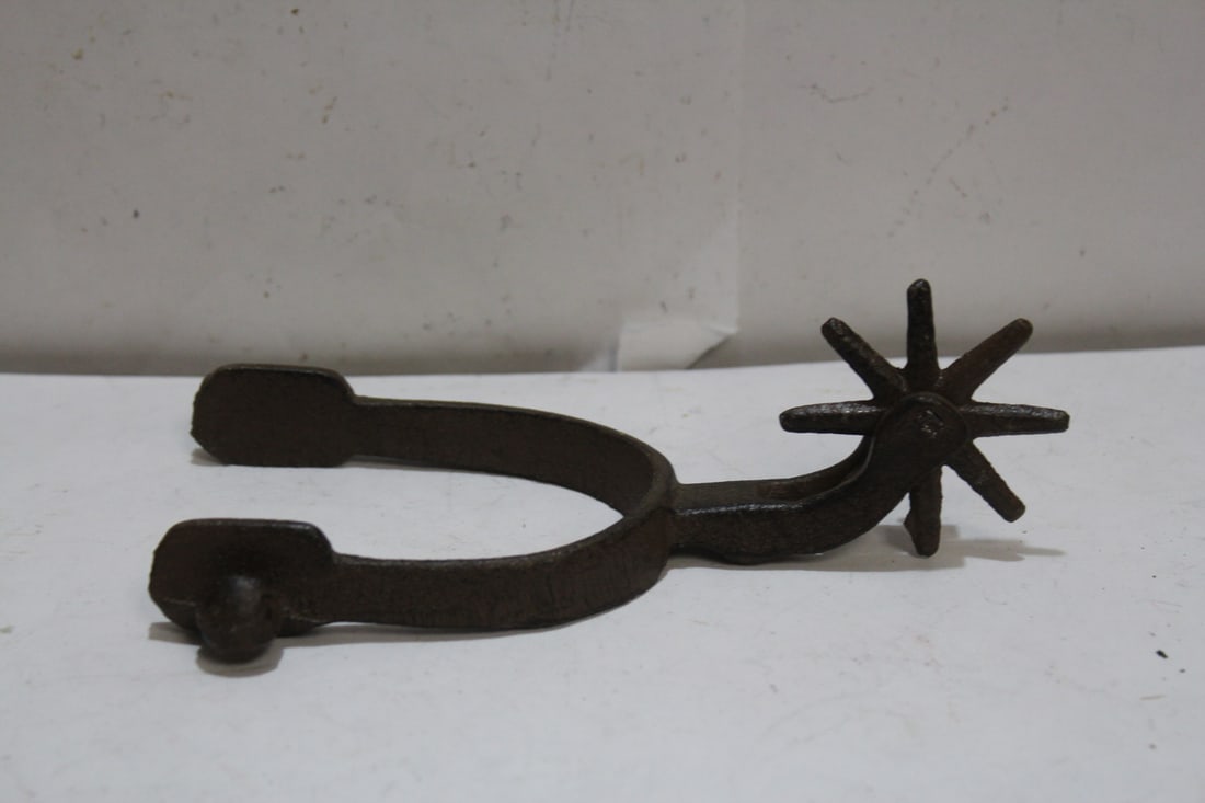 A Cast Iron Spur: 6 3/4" long