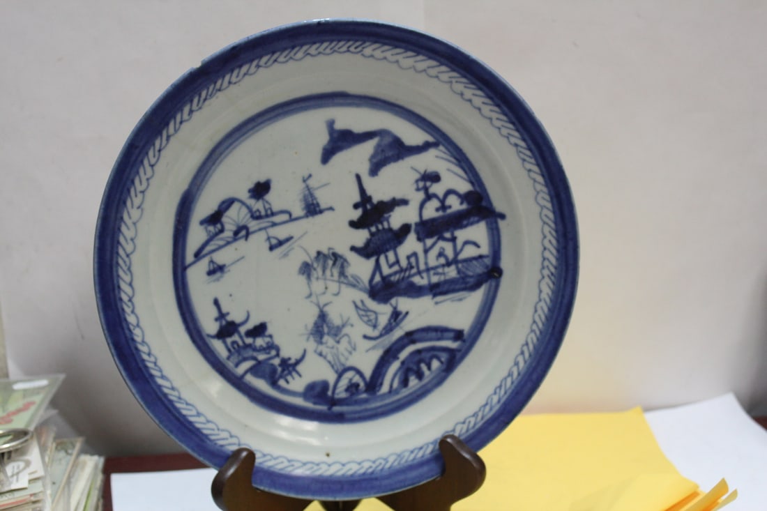 A Chinese Export Canton Pattern Blue and White Plate: 19th century - 10 1/4" in diameter - please note: chips and hairlines as shown