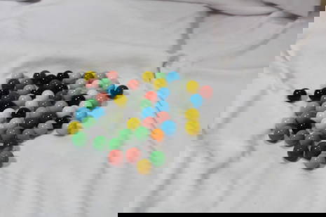 A Bag of 65 Marbles: As shown on photos