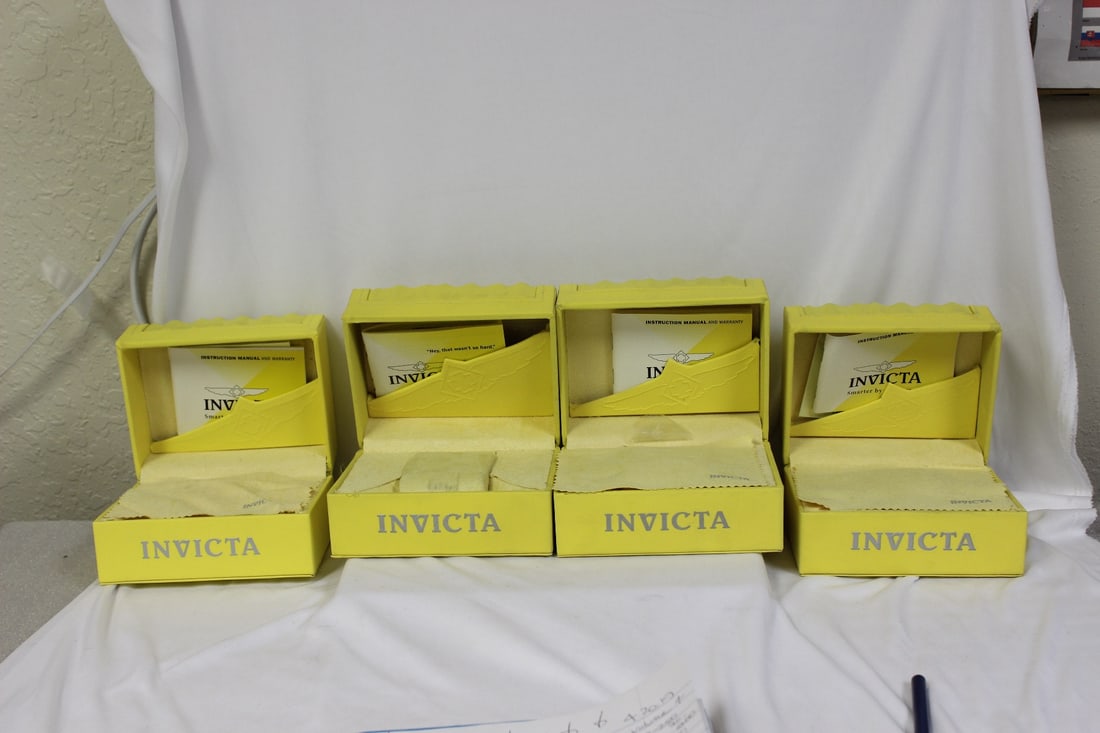 Empty Invicta Boxes: lot of 4 - all the same sizes - measures: 5 3/4" x 4 1/2" x 3 3/4" - all have some sort of paperwork inside - please note: no watches inside!