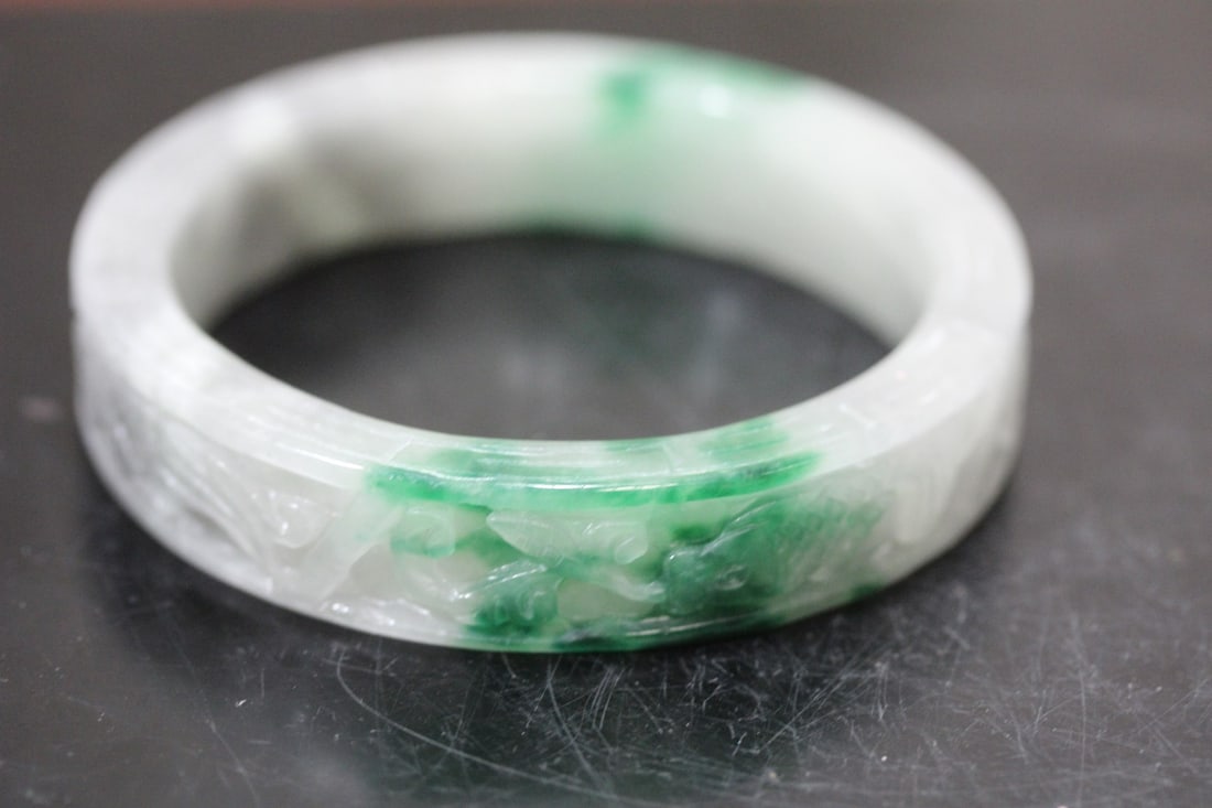 A Chinese Carved Jade Bangle Bracelet: inside diameter= 2 3/8"