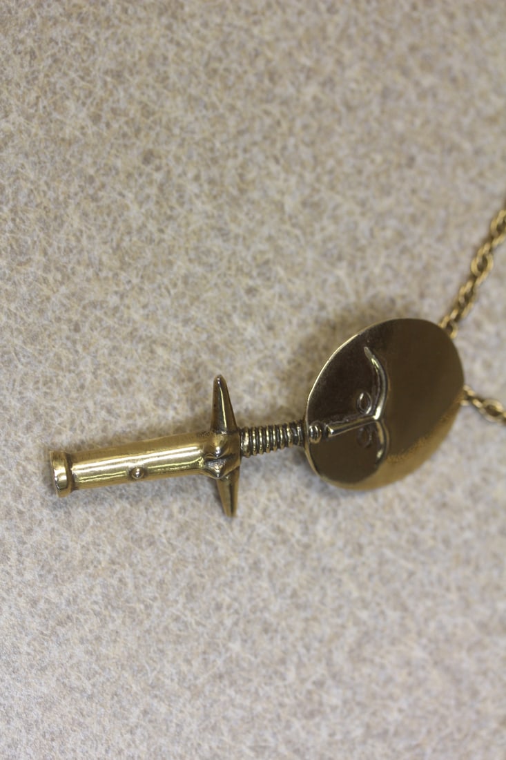 Gold plated necklace: Alva museum replica, gold plated chain and figure, overall 14" long, marked Alva