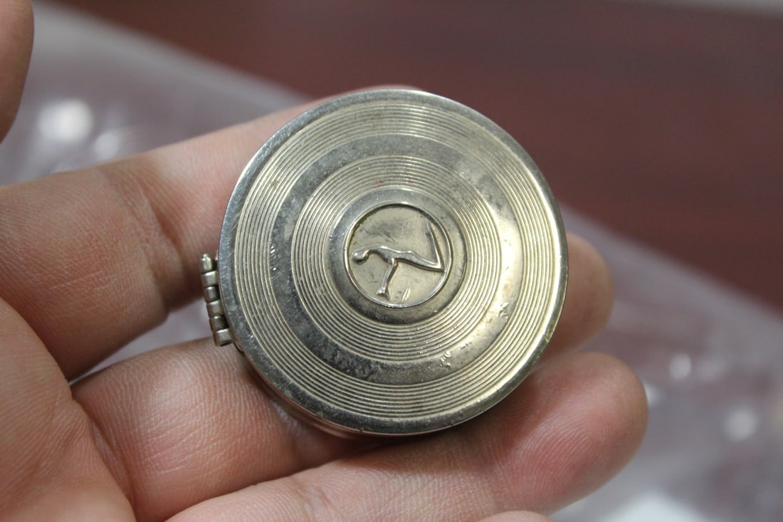 A Marvel Dust Compact: 1 1/2" in diameter