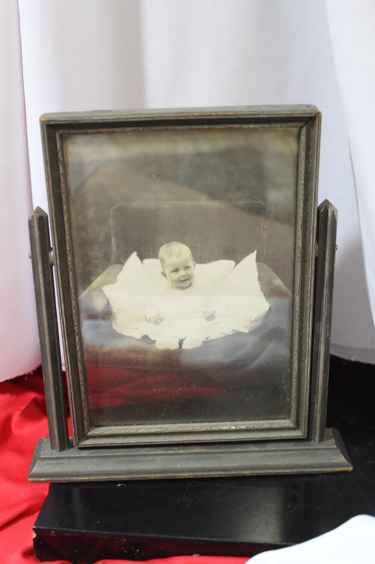 An Old Black and White Photograph of a Baby: and swiffle - wooden picture frame - overall= 8 1/8" tall