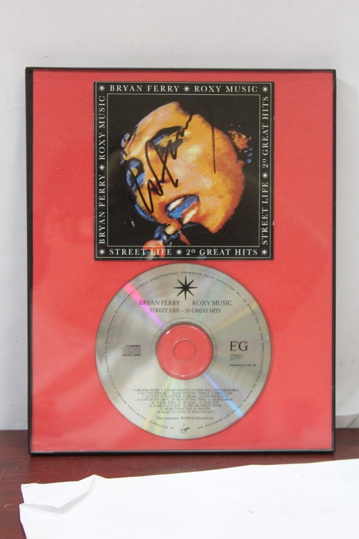 A Signed Bryan Ferry Cd: framed - 10 1/8" x 8 1/8"