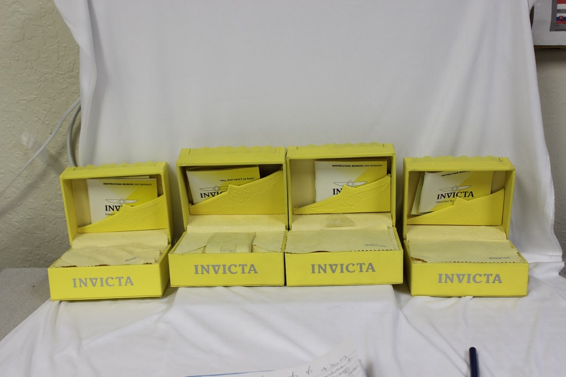 Empty Invicta Boxes: lot of 4 - all the same sizes - measures: 5 3/4" x 4 1/2" x 3 3/4" - all have some sort of paperwork inside - please note: no watches inside!