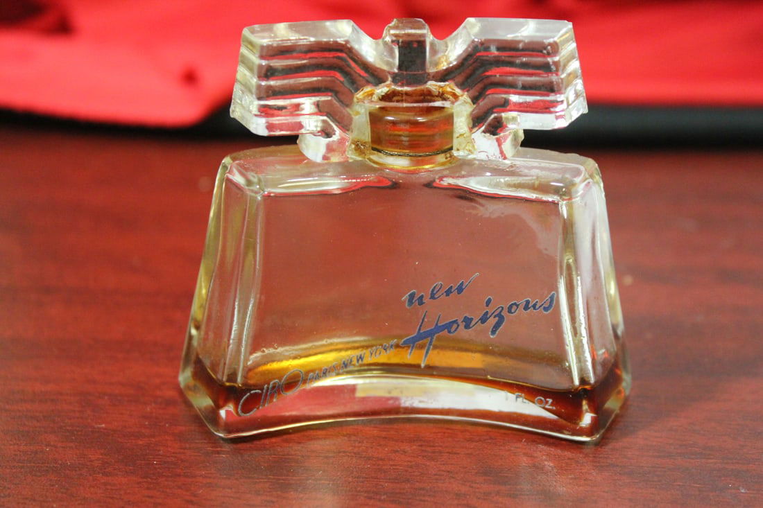 An Art Deco Parfume Bottle: "New Horizon Thunderbird" - very little parfume left - 2 7/8" tall