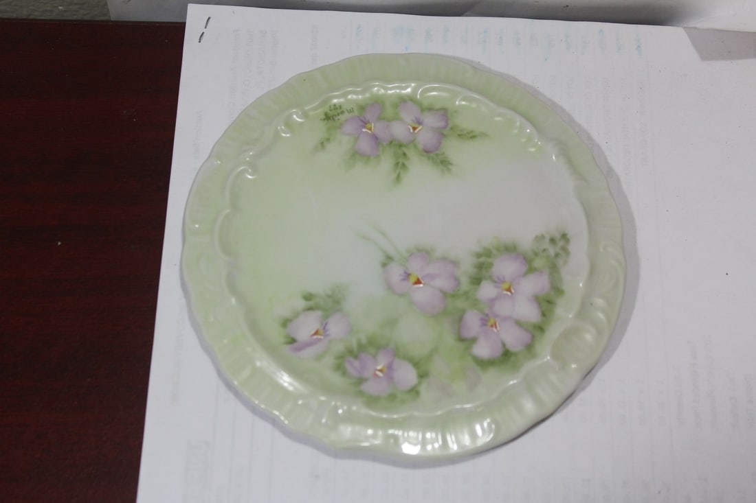 A Signed Porcelain Trivet: 6 1/4" in diameter