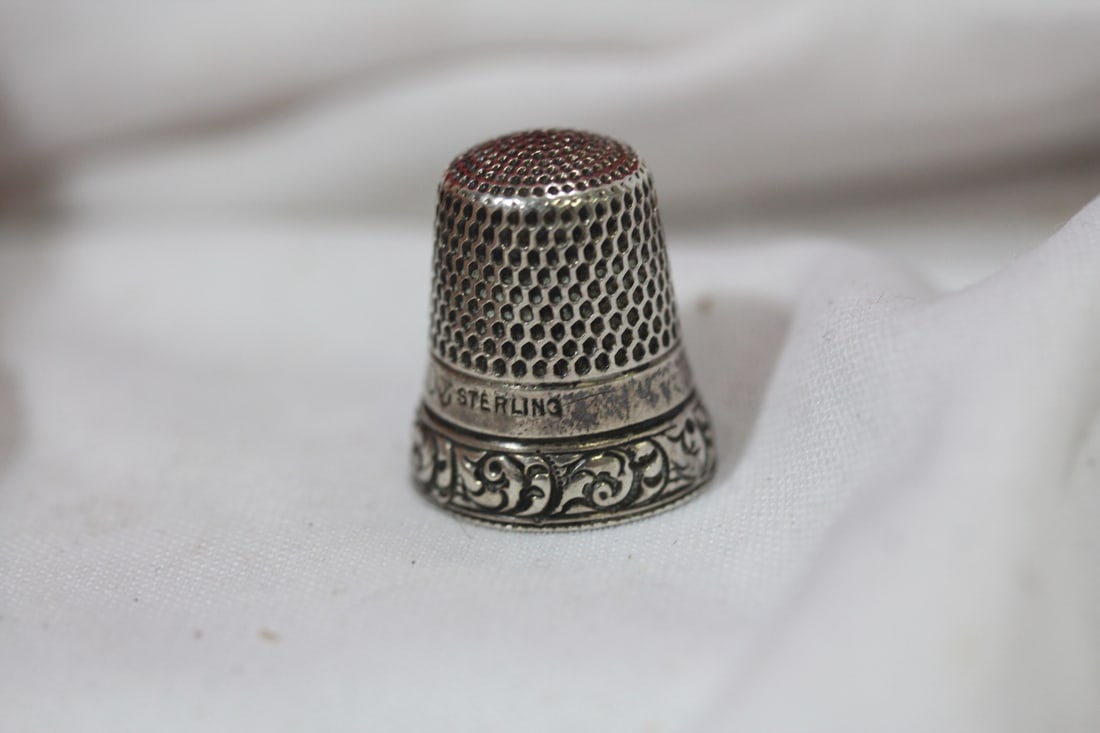 A Thimble: marked sterling